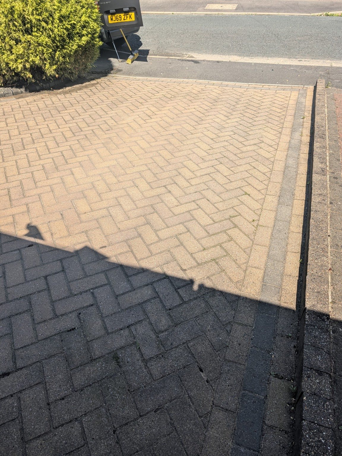 Block paved driveway before cleaning in Oldham