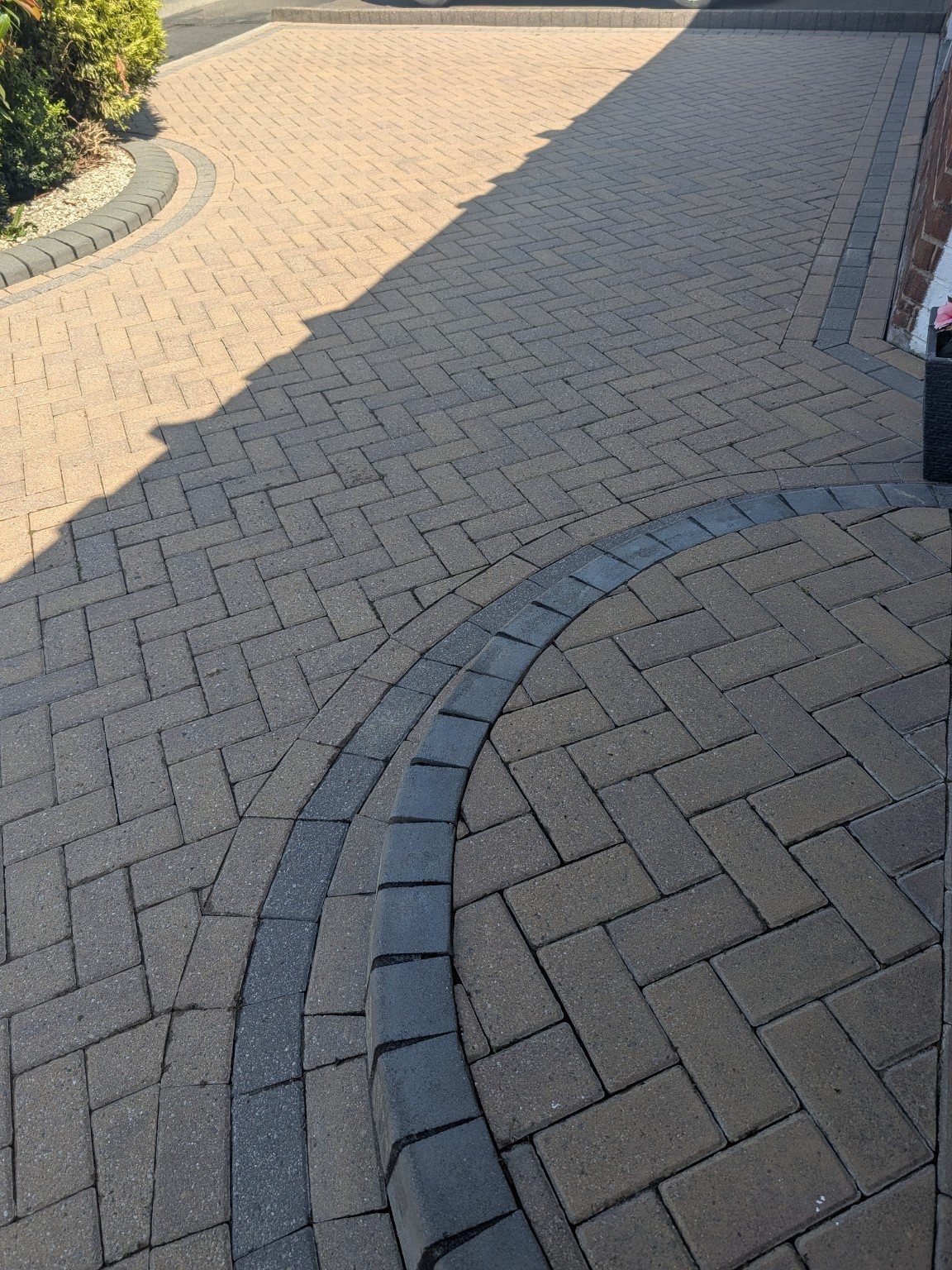Curved block paving border after cleaning