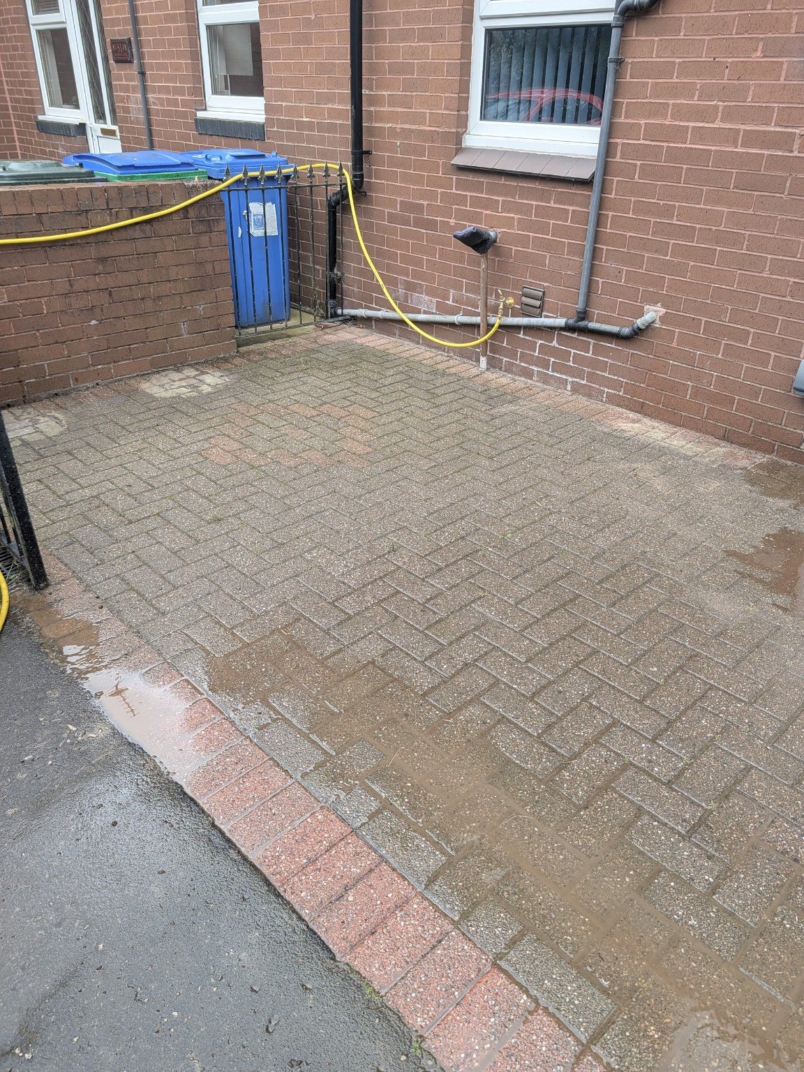 Rear block paved area before cleaning