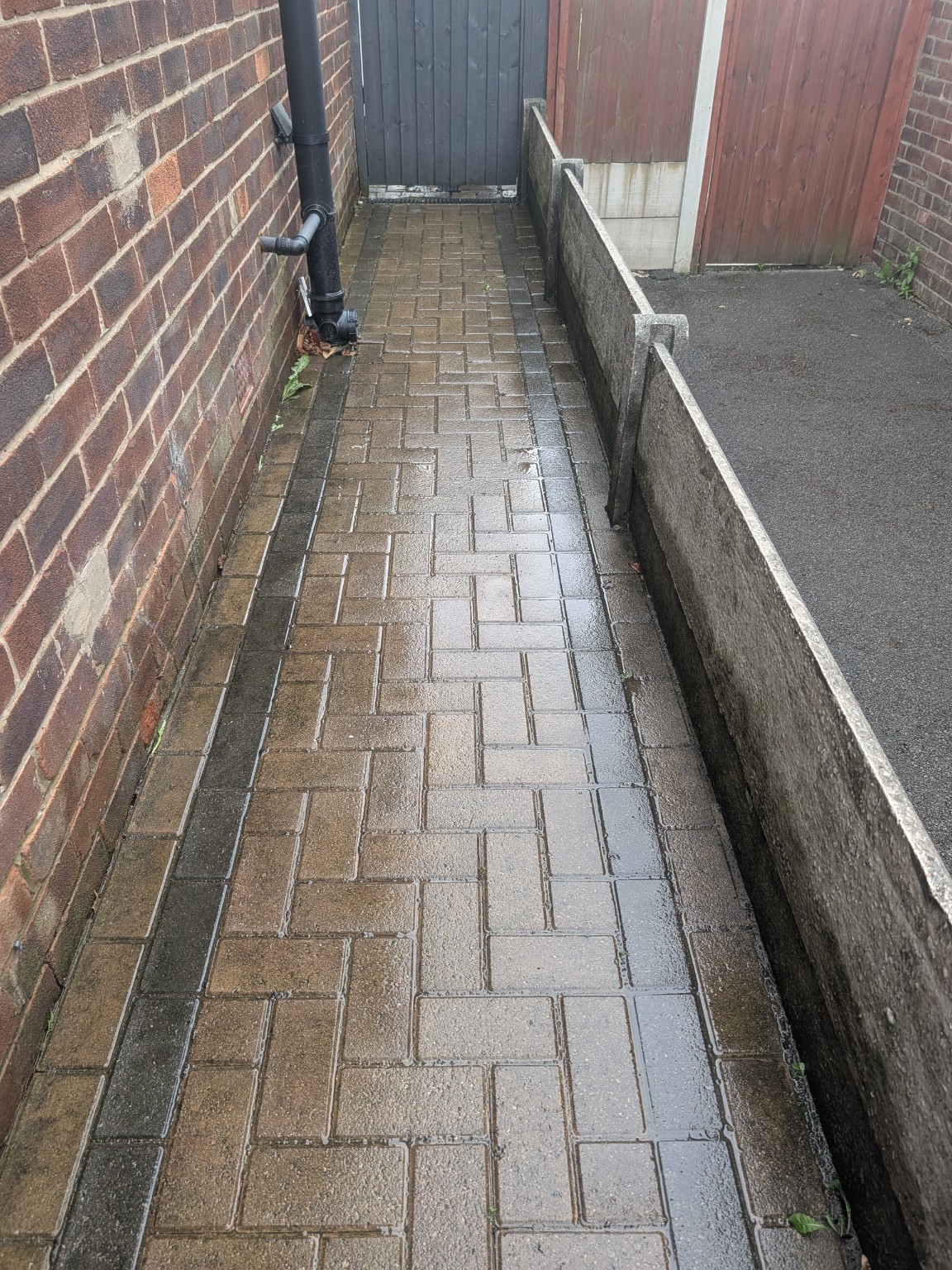 Dirty block paved side path before professional cleaning