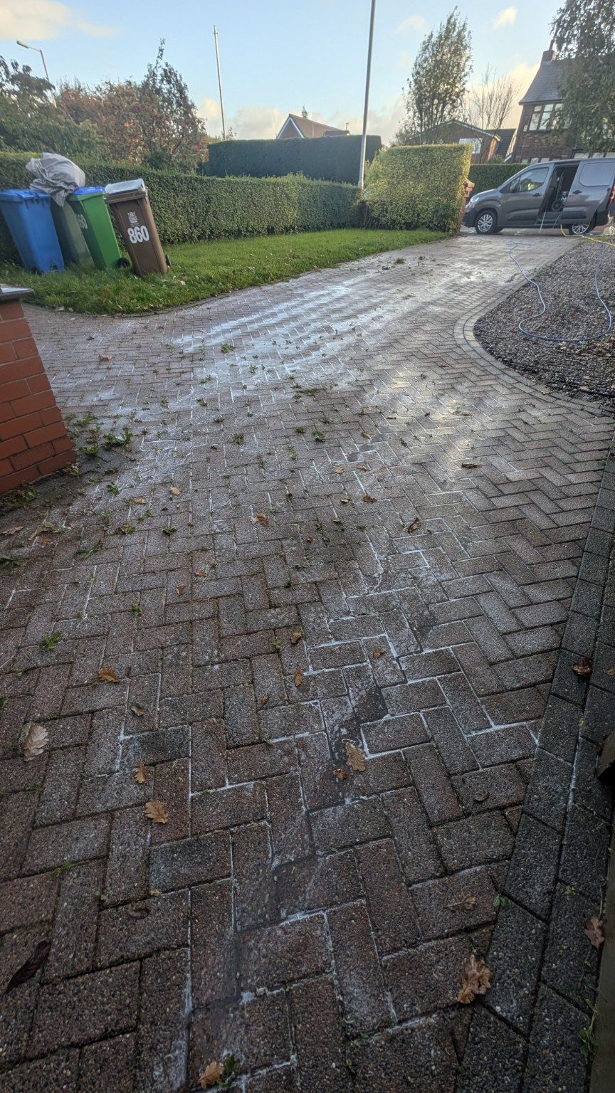 Curved driveway before cleaning in Royton