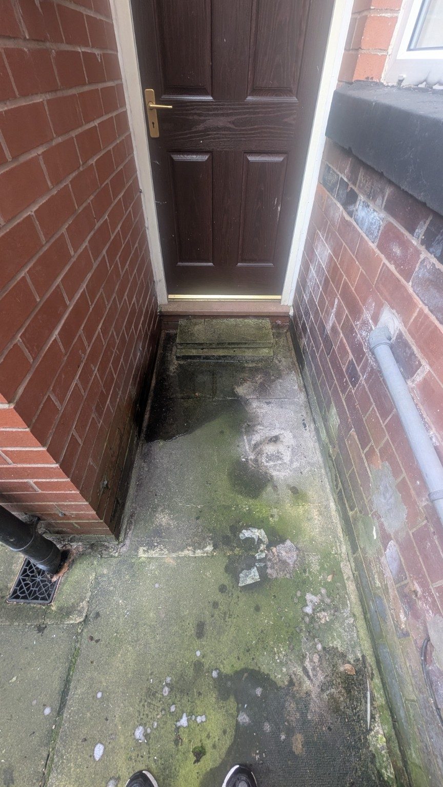 Doorway before cleaning in Chadderton