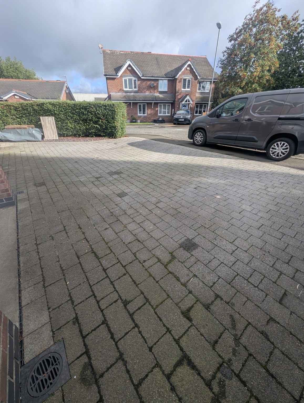 Block paving driveway before cleaning in Milnrow