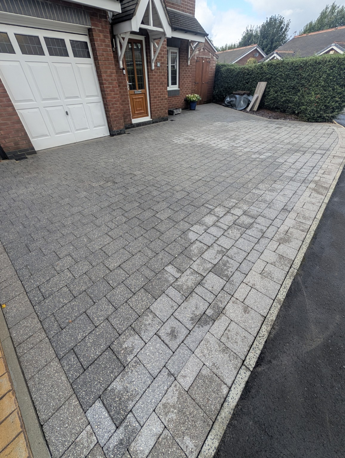 Second angle of block paving driveway after cleaning in Milnrow