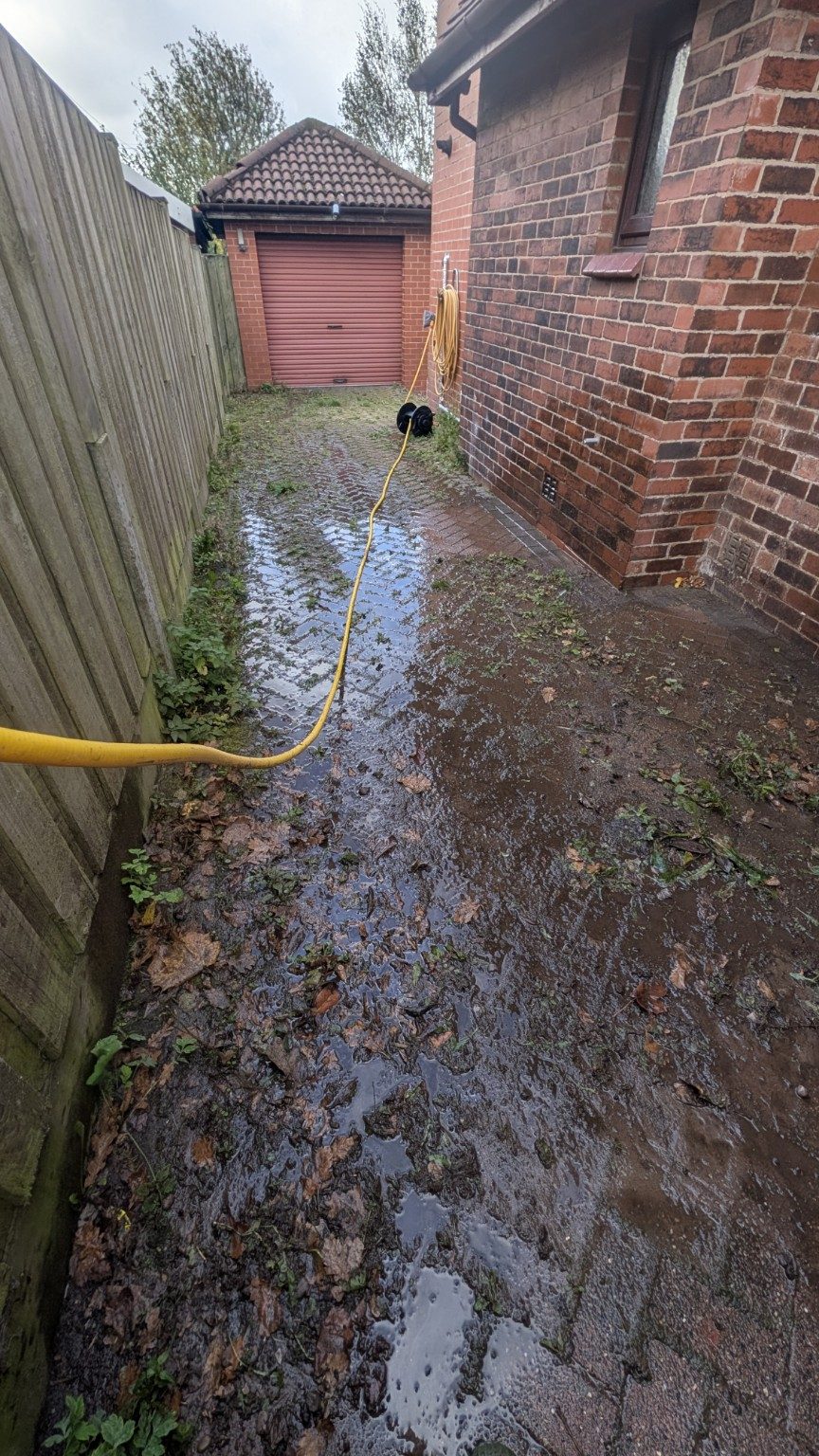 Side driveway before cleaning in Royton