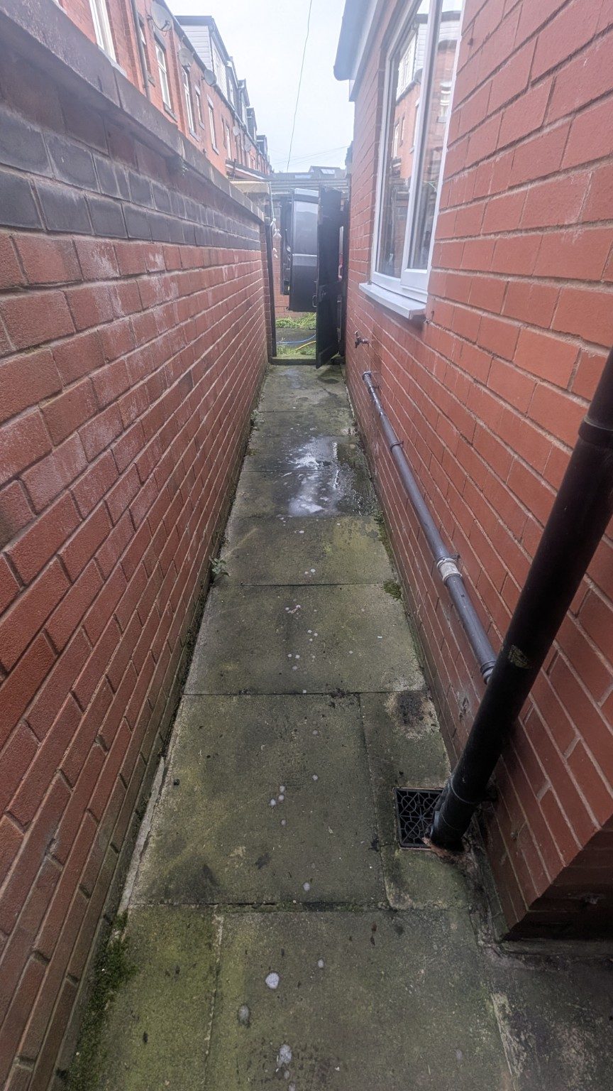 Side passage before cleaning in Chadderton